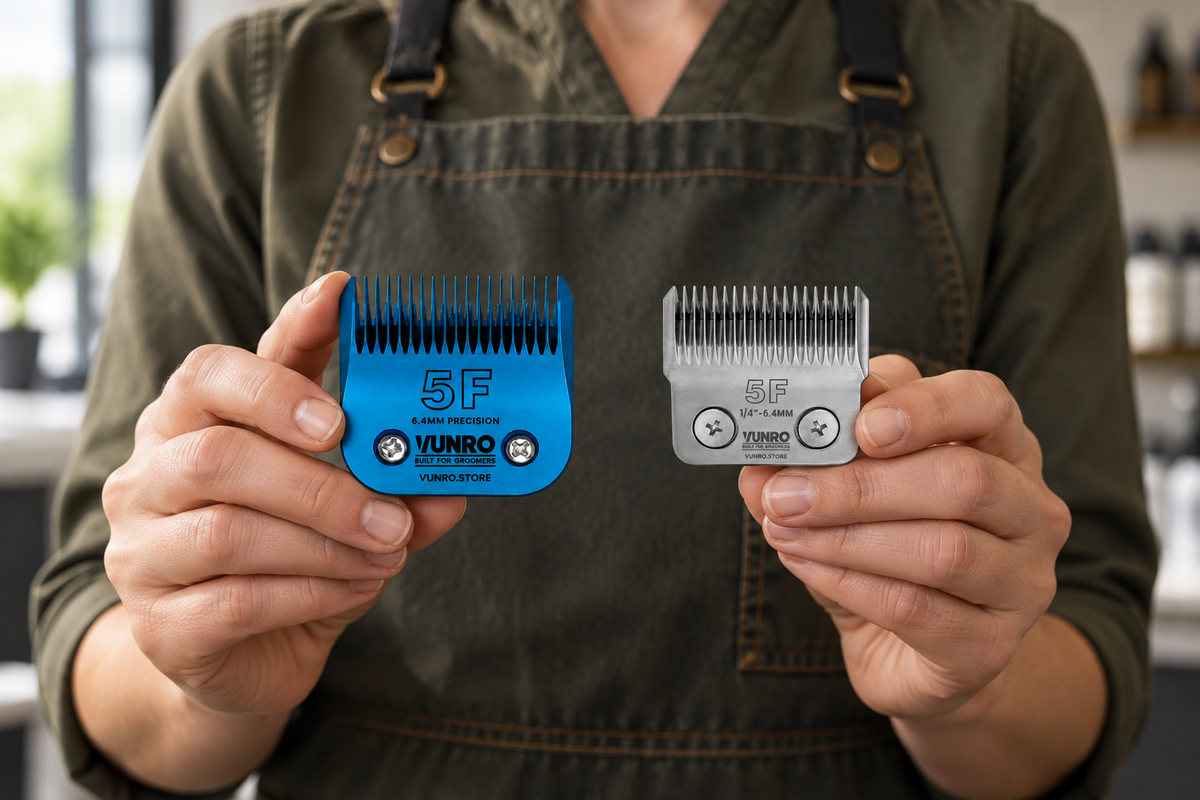 Groomer holding a blue A5 5F blade and a D-Series 5F blade to compare their different fittings